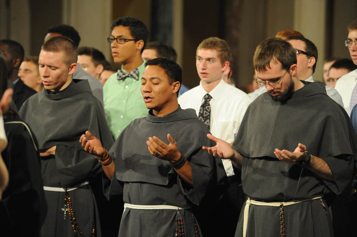 Franciscan Friars praying the Lord's Prayer